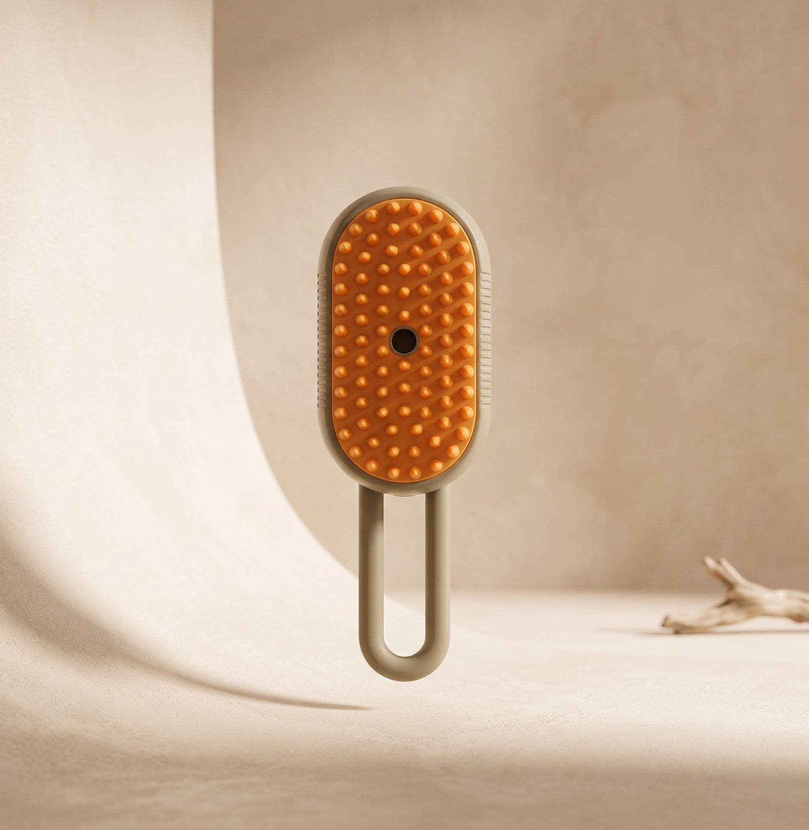 Nuzzo 3-in-1 pet spa brush with orange massage nodes and sage green handle for misting and de-shedding