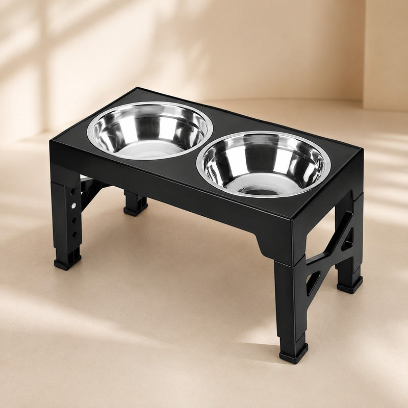 Nuzzo AdjustaBowl 5-level elevated dog feeder with two stainless steel bowls in a black adjustable stand.