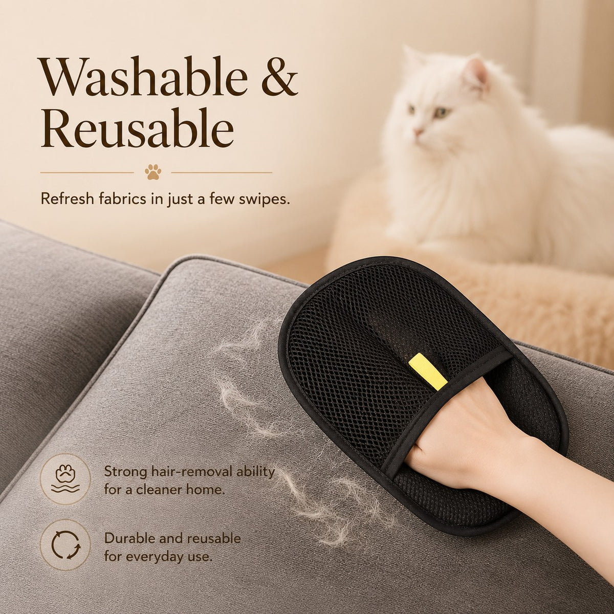 Nuzzo FurLift black mesh pet hair removal glove cleaning grey sofa fabric with a white cat in the background