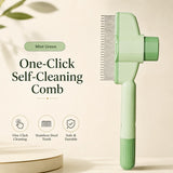 Nuzzo mint green self-cleaning pet hair comb with stainless steel teeth and a one-click release button for easy grooming.