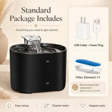 Nuzzo PureFlow black smart pet fountain with flowing water, USB power cable, plug, and filter element components.