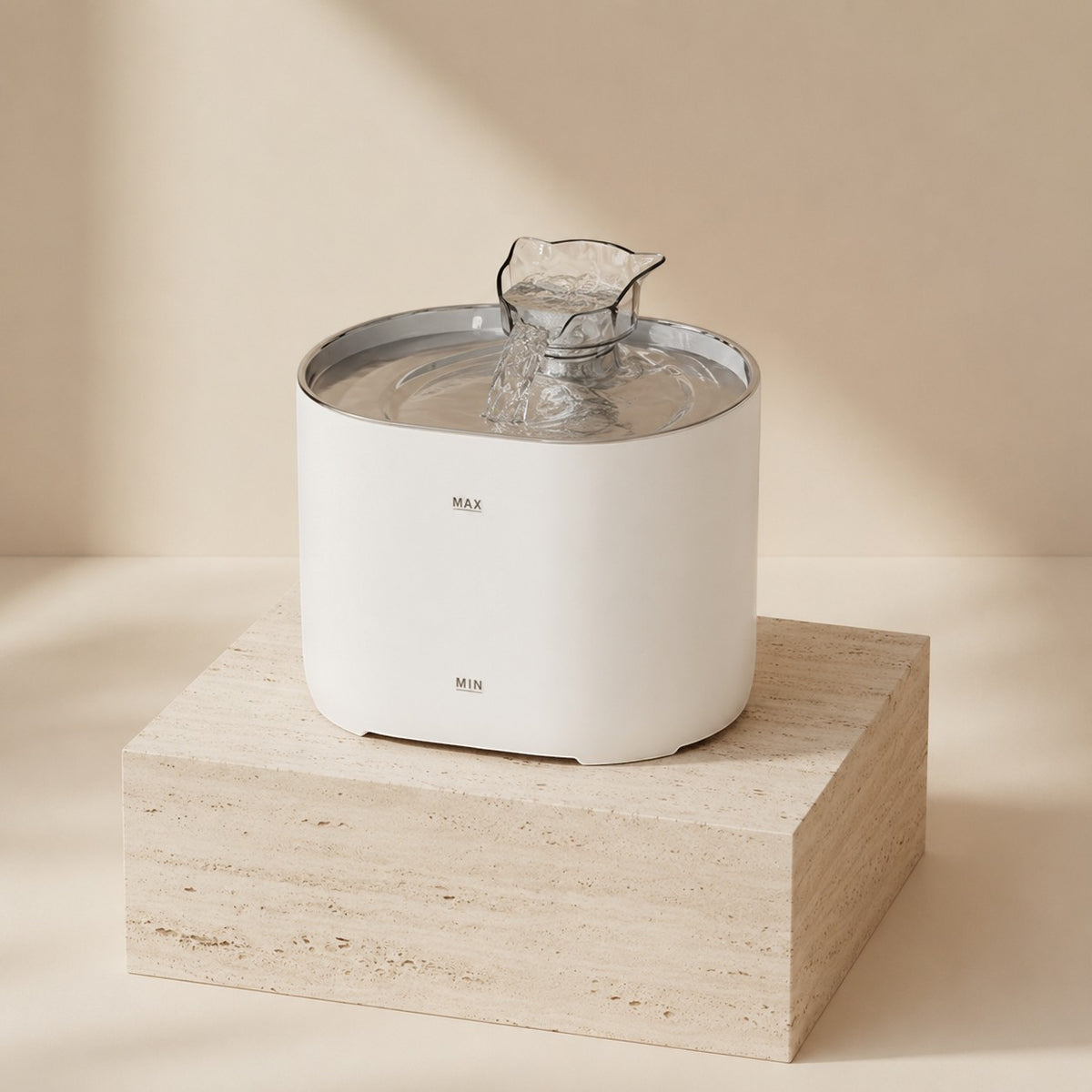 Nuzzo PureFlow white smart pet fountain with continuous water circulation on a stone pedestal
