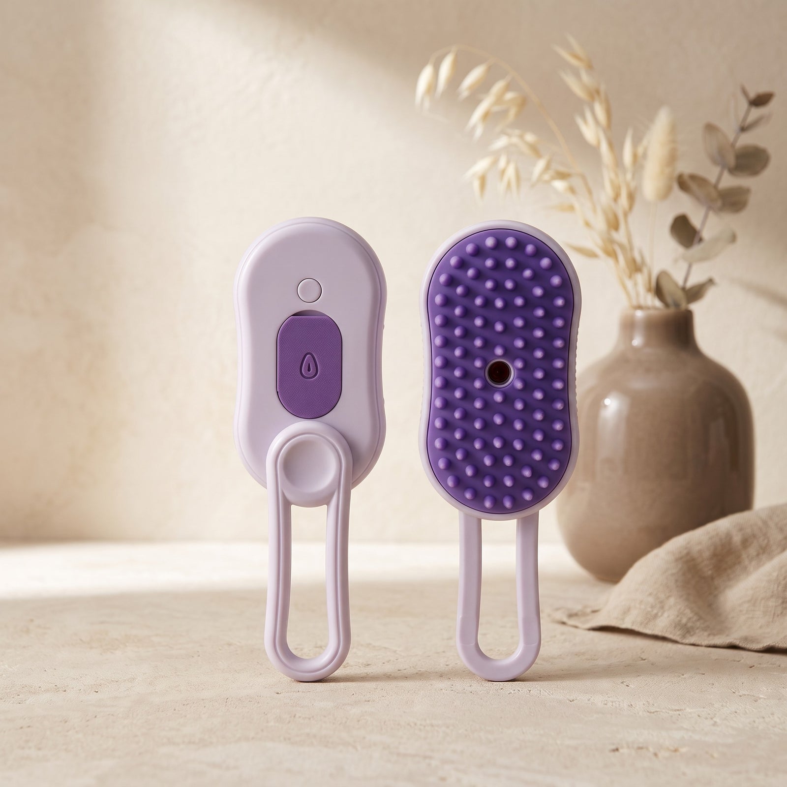 Nuzzo 3-in-1 electric pet spa brush in purple with misting function and soft massage bristles for grooming.