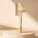 Nuzzo self-cleaning pet hair comb with yellow and cream ABS handle and stainless steel teeth on a pedestal